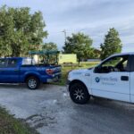 Licensed electrician trucks parked outside Commercial property