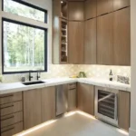 Modern kitchen with wooden cabinets and under-cabinet lighting.
