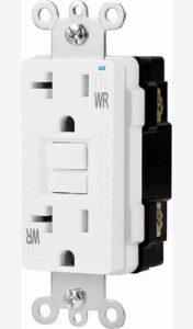 Close-up of a white electrical outlet with a test/reset button and safety features.